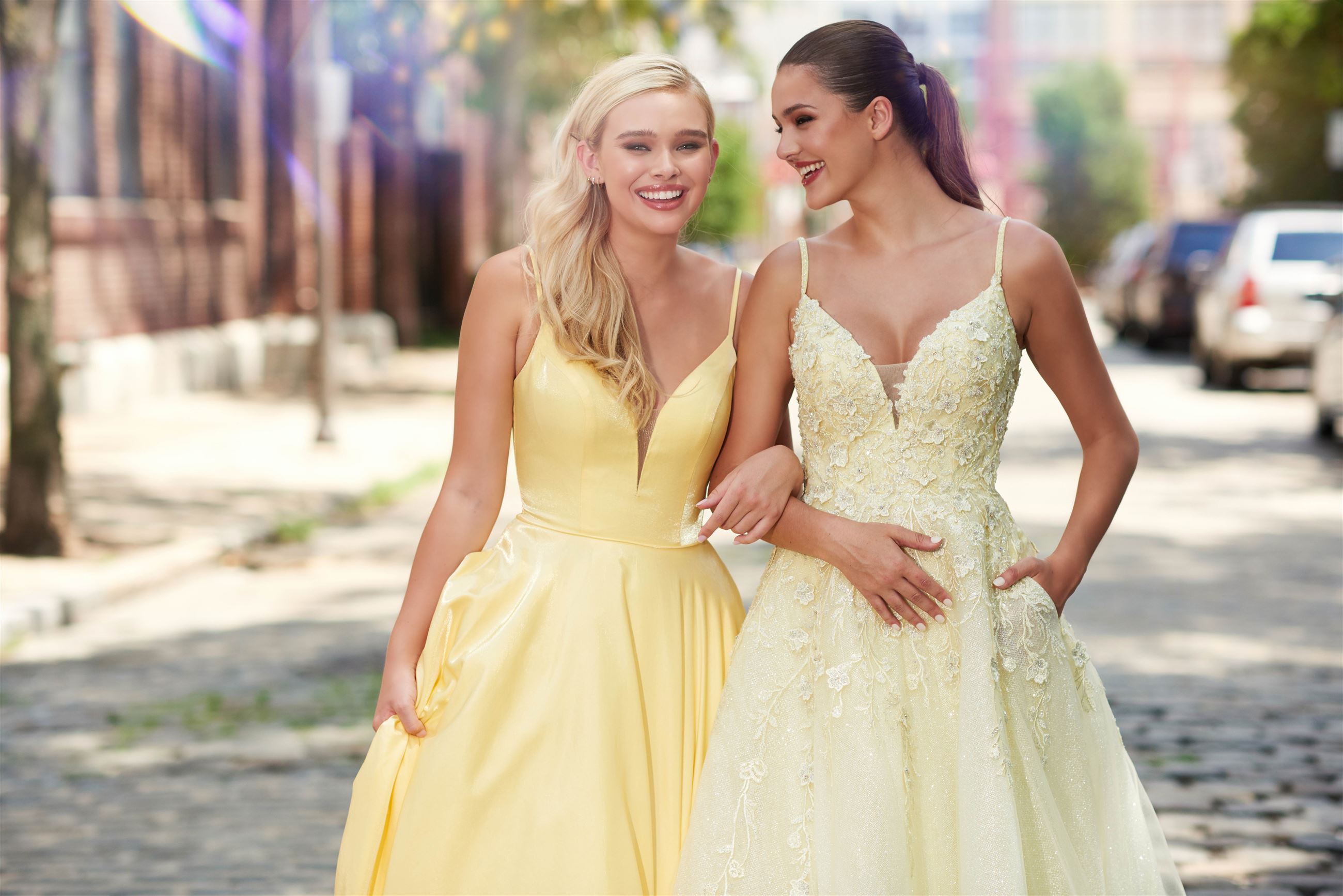 Two girls in yellow prom dresses with pockets by Ellie Wilde