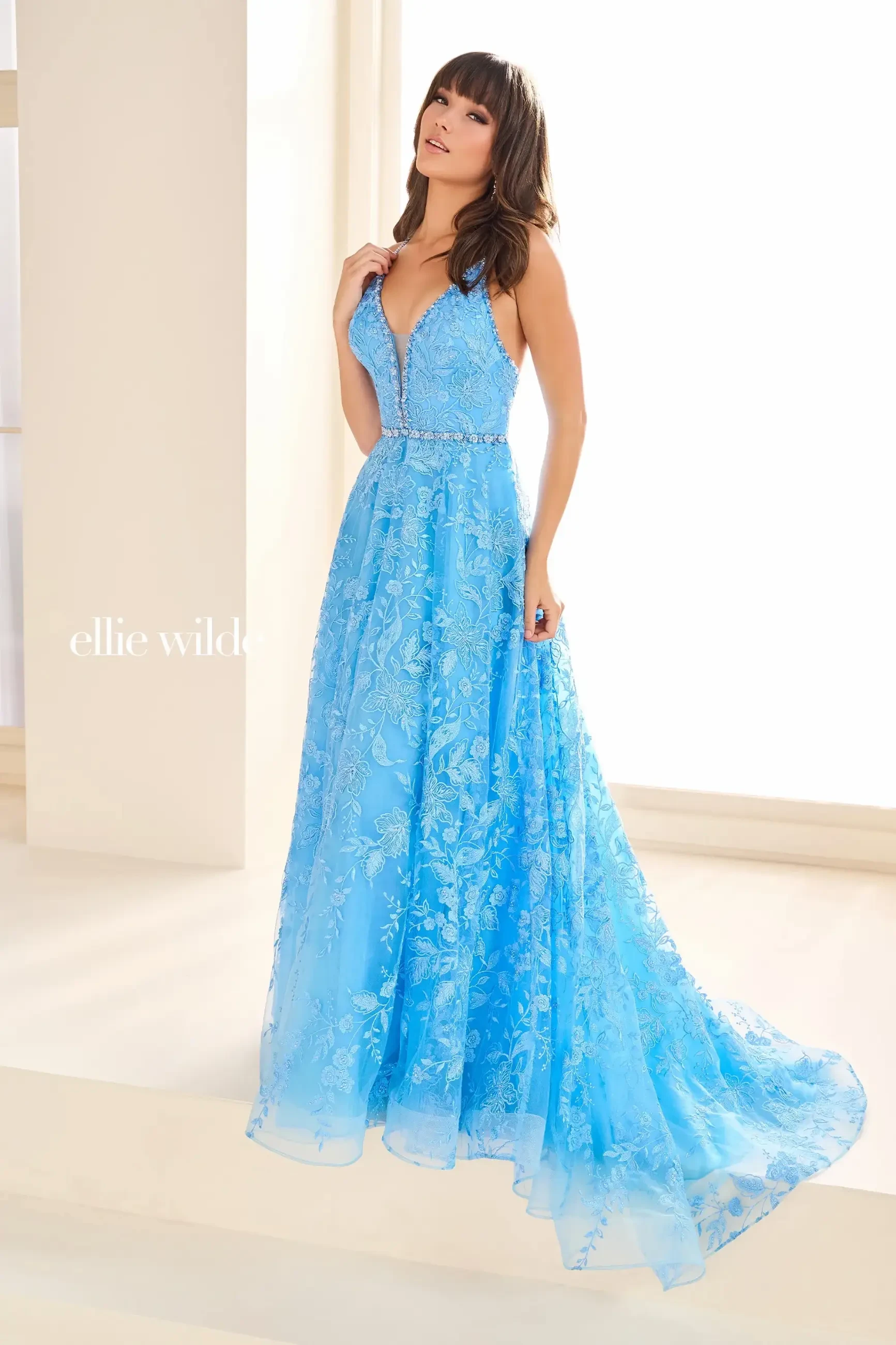 model is wearing a sleeveless a-line light blue evening dress