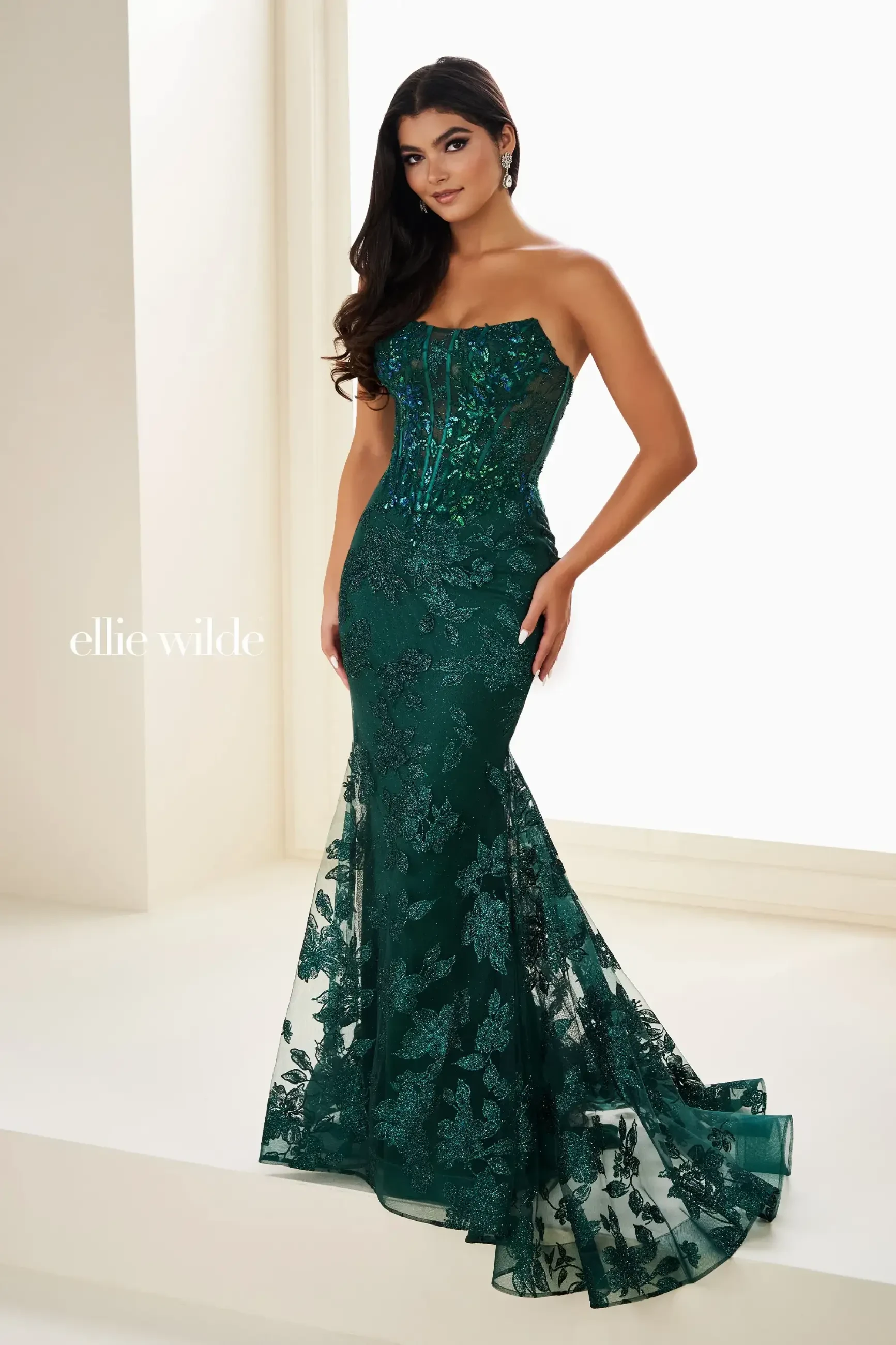 Model is wearing a mermaid basque waist prom dress