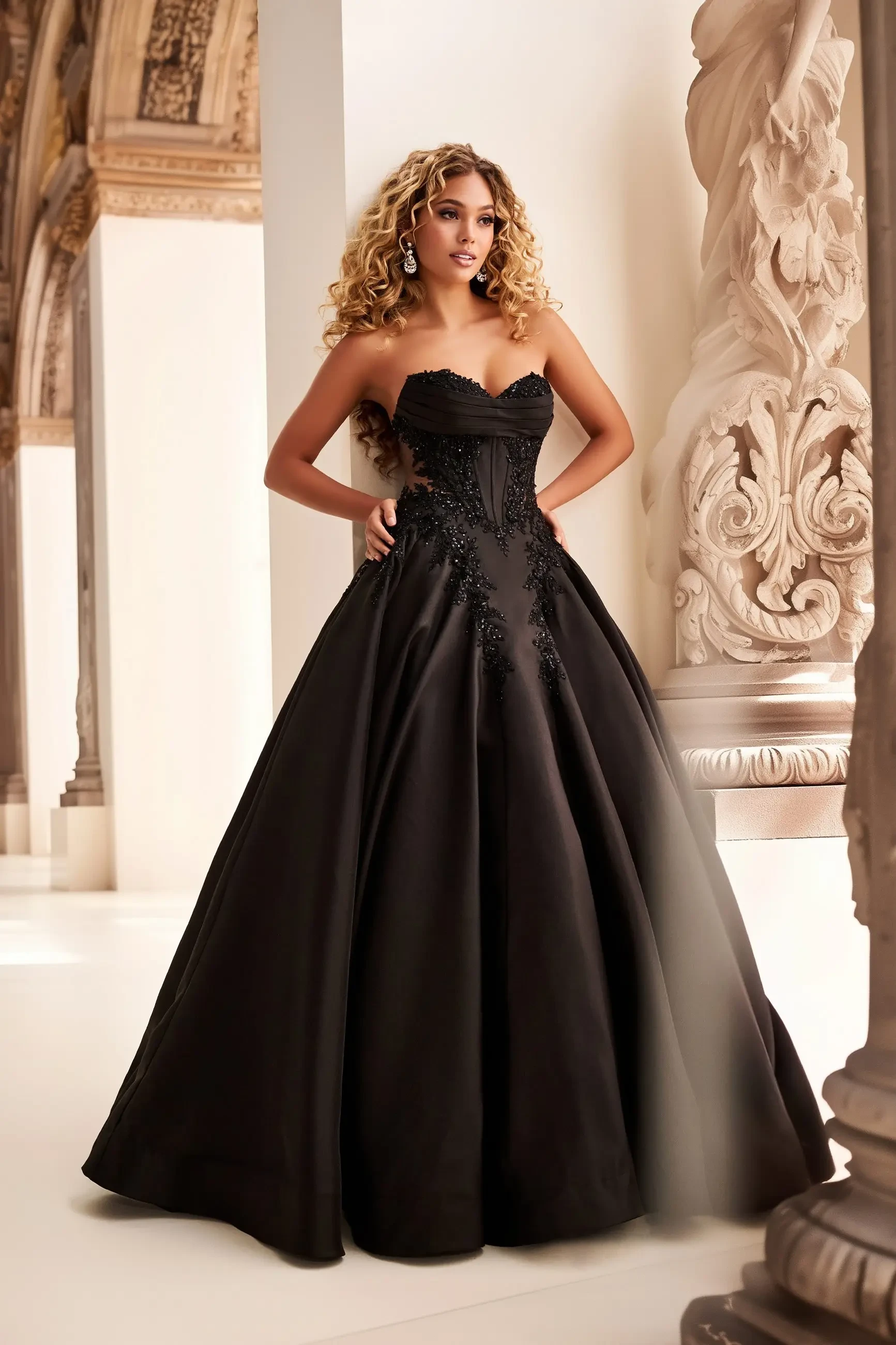 Strapless ball gown with a sweetheart neckline, mikado fabric, lace appliqué, and sequin and stone